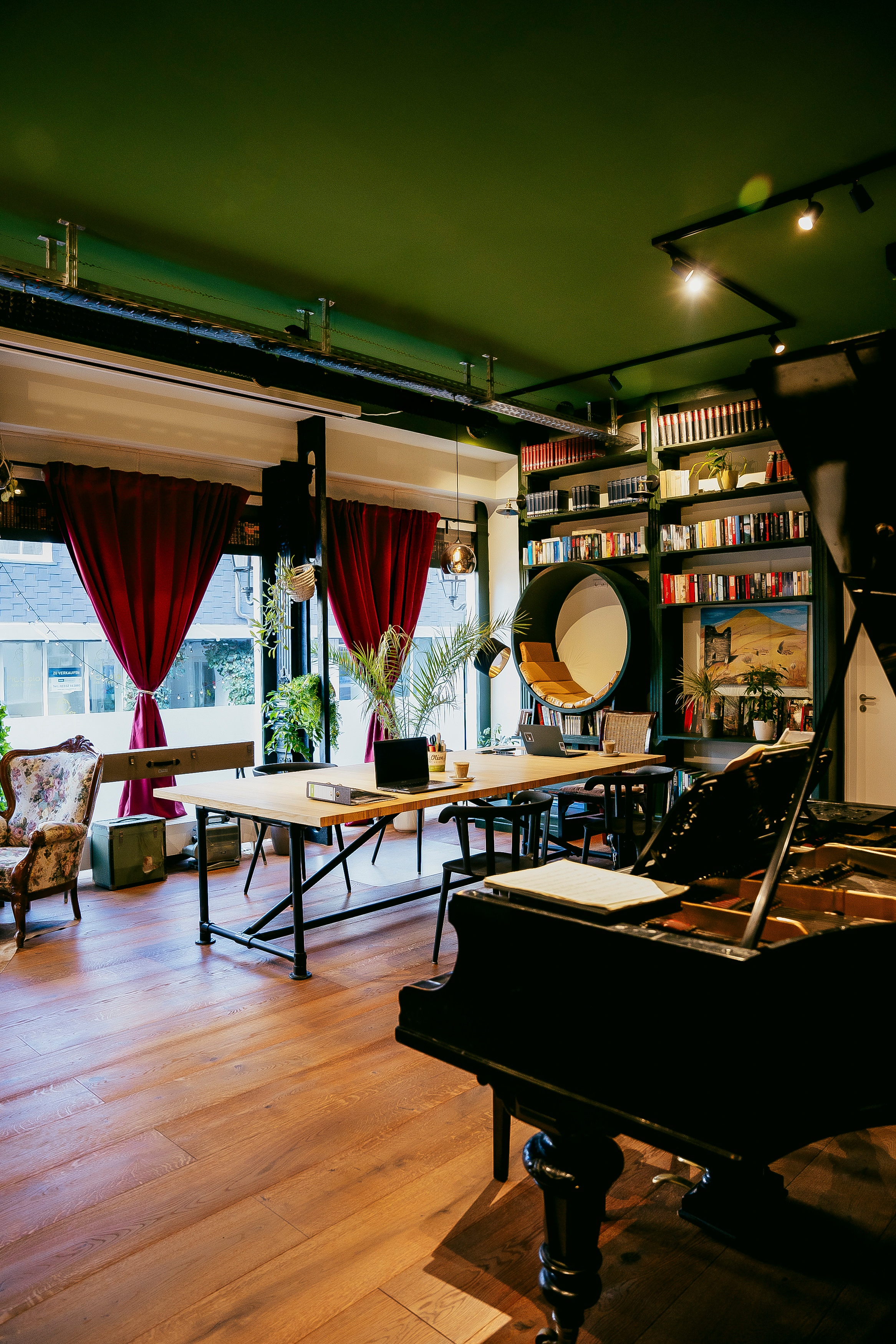 Nekalo Coworking Space with Piano and Green Walls